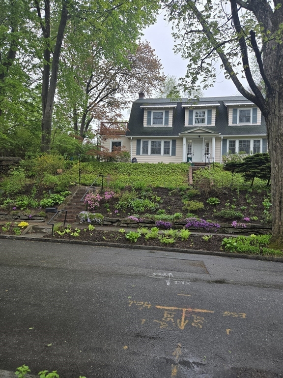 8 Montvale Road Worcester, MA 01609 - Photo 2 of 31 a front view of a house with a yard and potted plants