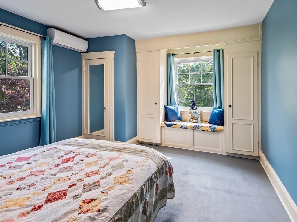 8 Montvale Road Worcester, MA 01609 - Photo 22 of 31 a room with a bed table and a window