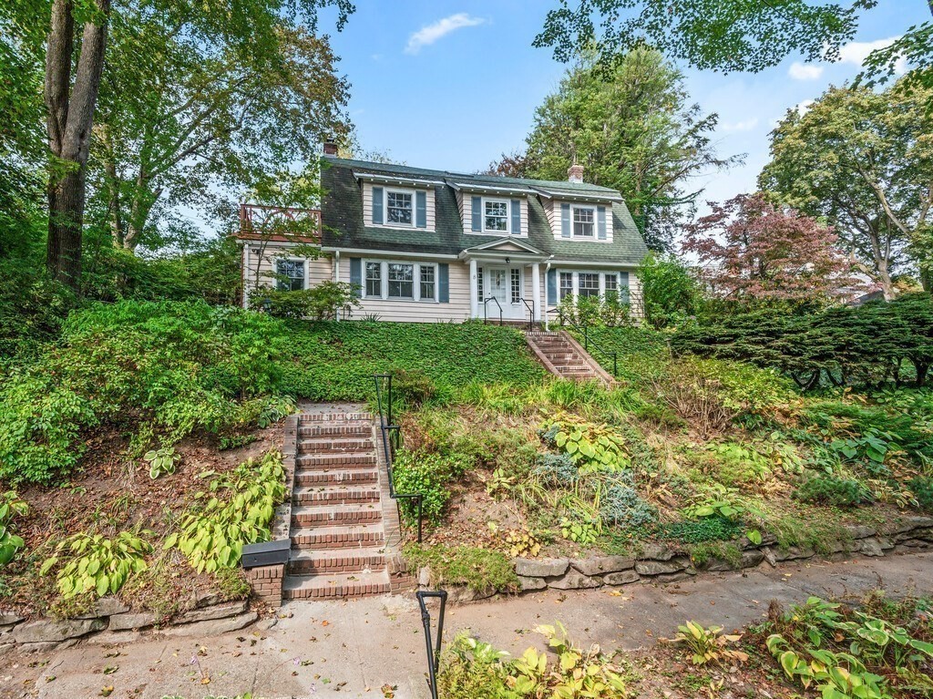8 Montvale Road Worcester, MA 01609 - Photo 29 of 31 a front view of a house with a yard and trees