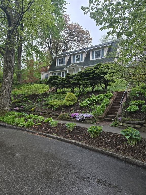 8 Montvale Road Worcester, MA 01609 - Photo 3 of 31 a front view of a house with a yard and potted plants