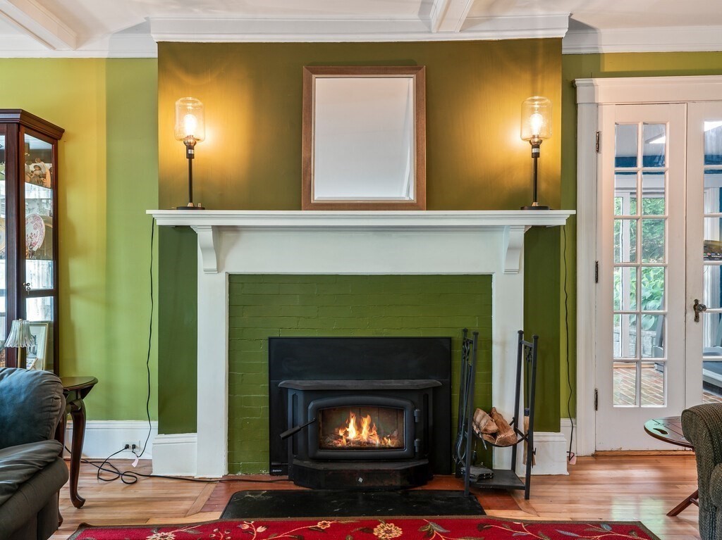 8 Montvale Road Worcester, MA 01609 - Photo 9 of 31 a living room with furniture and a fireplace