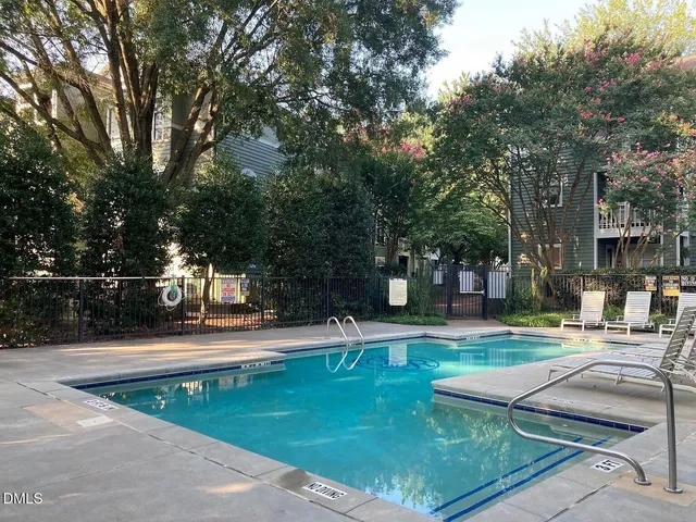 a view of a patio with a table and chairs