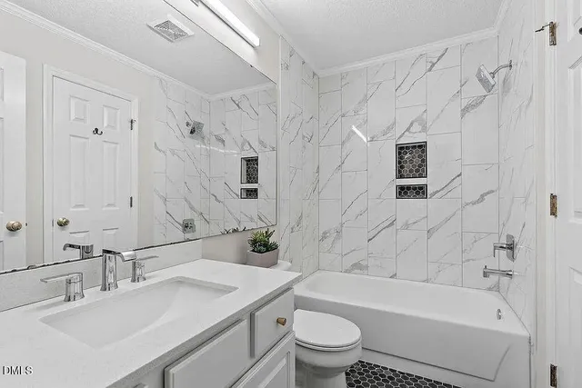 a bathroom with a sink a toilet and a bathtub