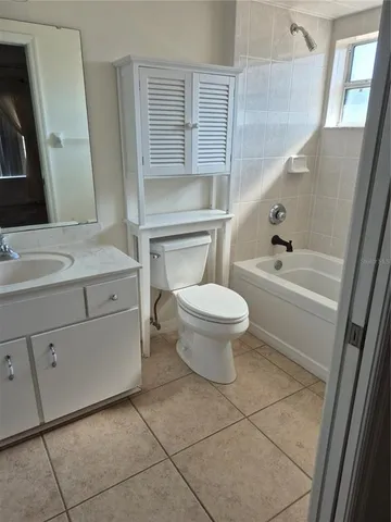 a bathroom with a sink a toilet and bathtub