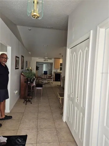 a living room with furniture a window and gym equipment
