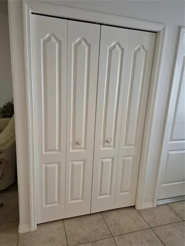 a view of a door with wooden floor