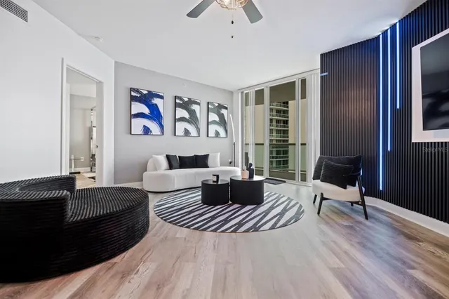 a bedroom with a bed couch and a window