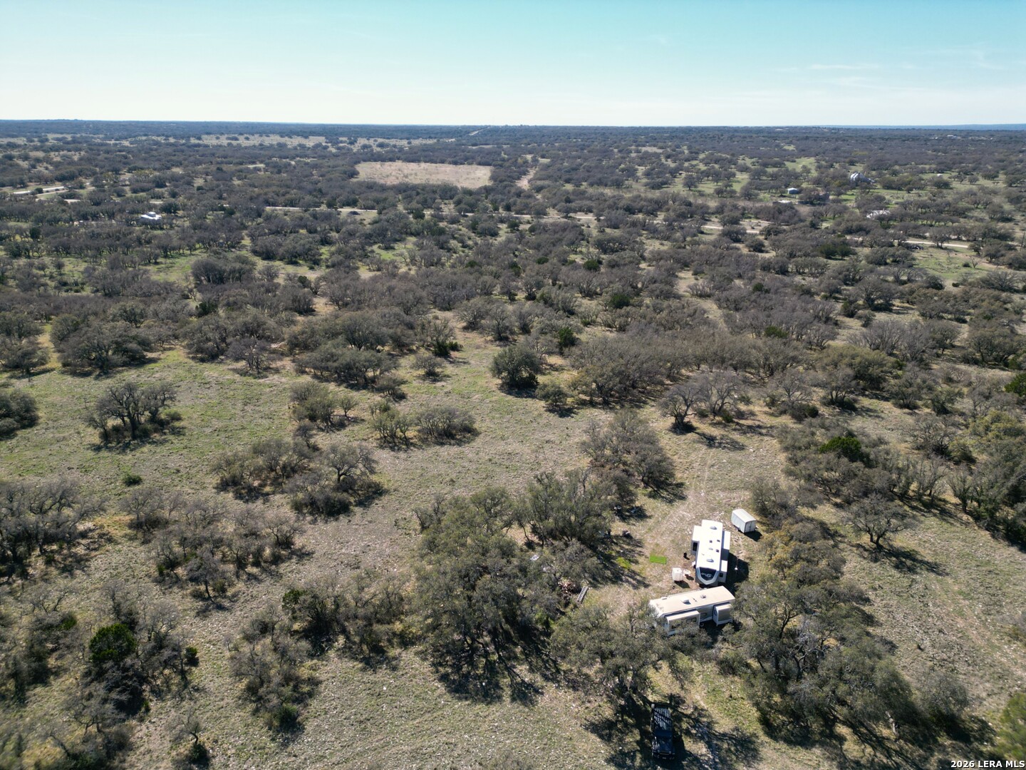 264 Pheasant Trail Menard, TX 76859 - Photo 14 of 15 an aerial view of house with yard and mountain view in back
