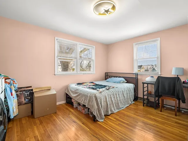 a bedroom with a bed and a table in it