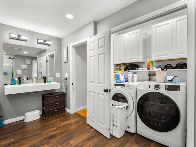 a view of kitchen and sink with wooden floor