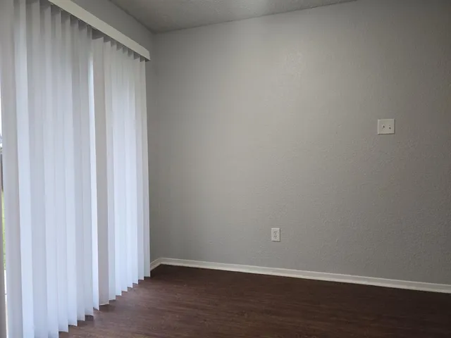 a view of a small space with wooden floor