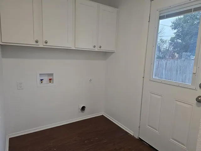 a view of cabinets and window