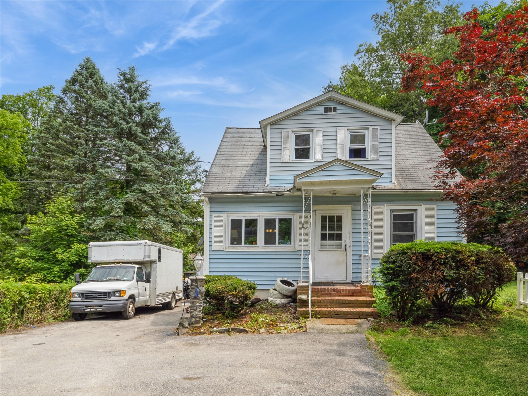 413 Vassar Road Poughkeepsie, NY 12603 - Photo 1 of 38 a front view of a house with a yard