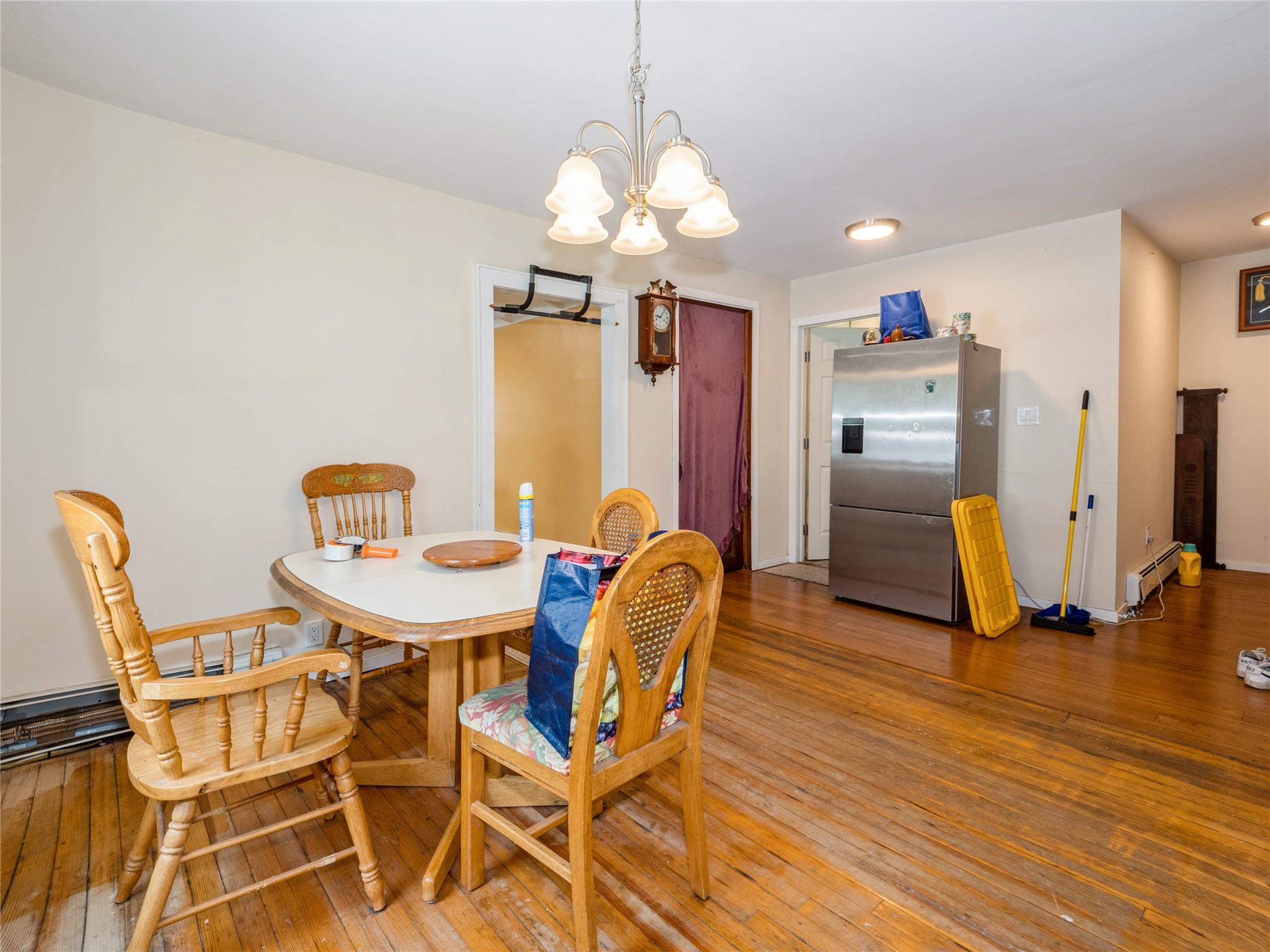 413 Vassar Road Poughkeepsie, NY 12603 - Photo 13 of 38 a view of a dining room with furniture and wooden floor