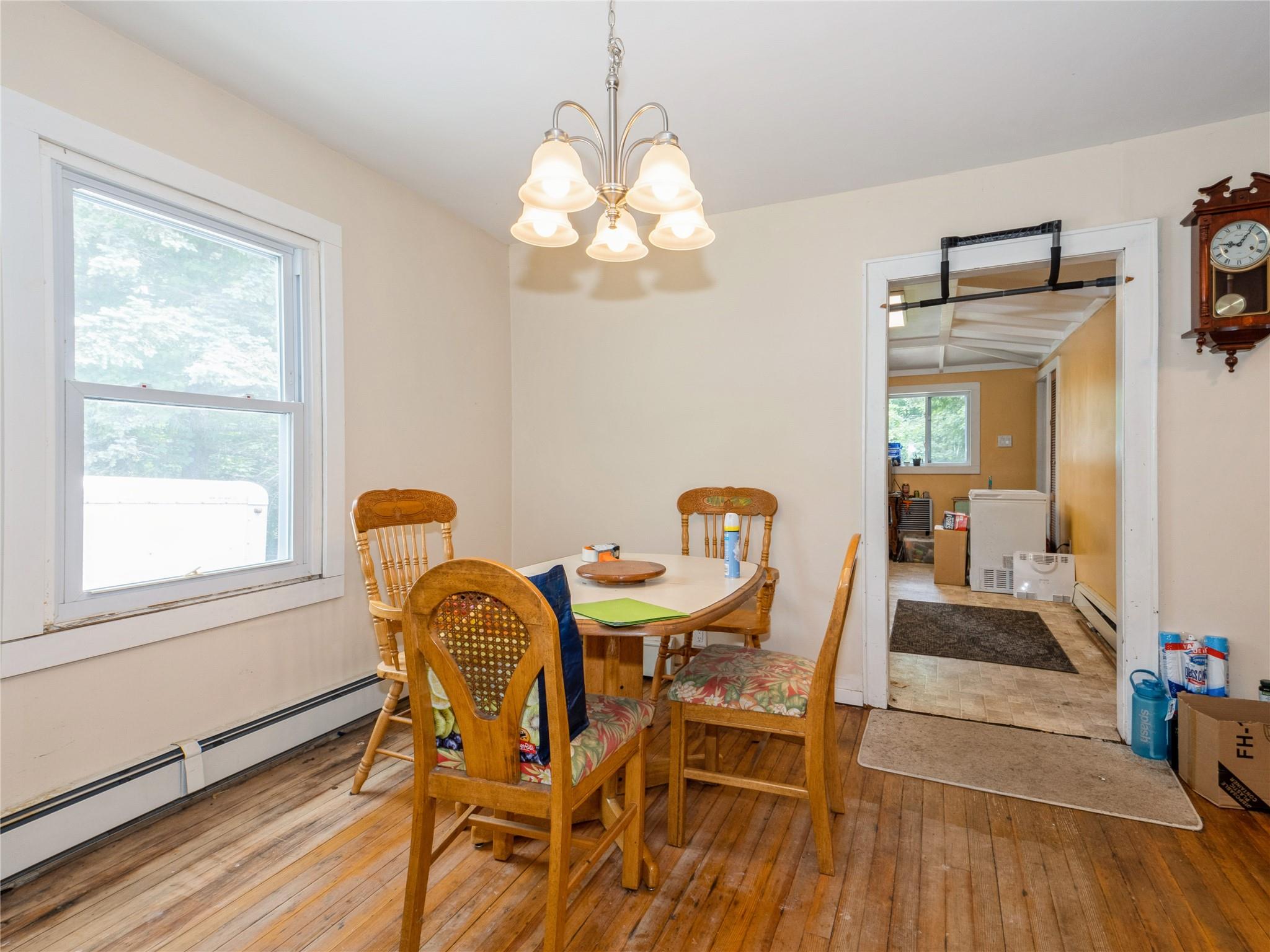 413 Vassar Road Poughkeepsie, NY 12603 - Photo 14 of 38 a view of a dining room with furniture and wooden floor