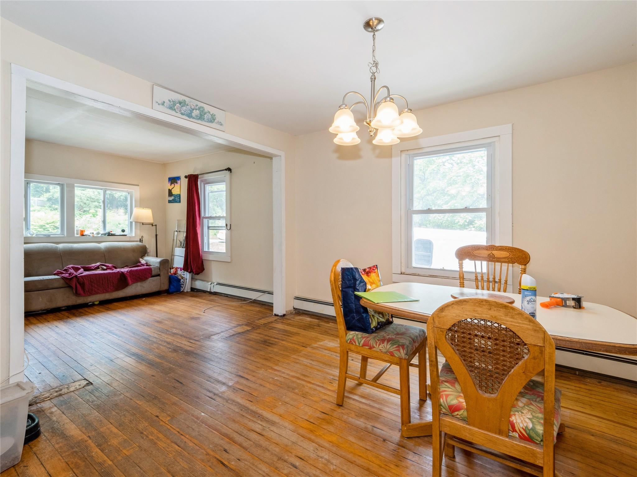 413 Vassar Road Poughkeepsie, NY 12603 - Photo 15 of 38 a view of a dining room with furniture window and wooden floor
