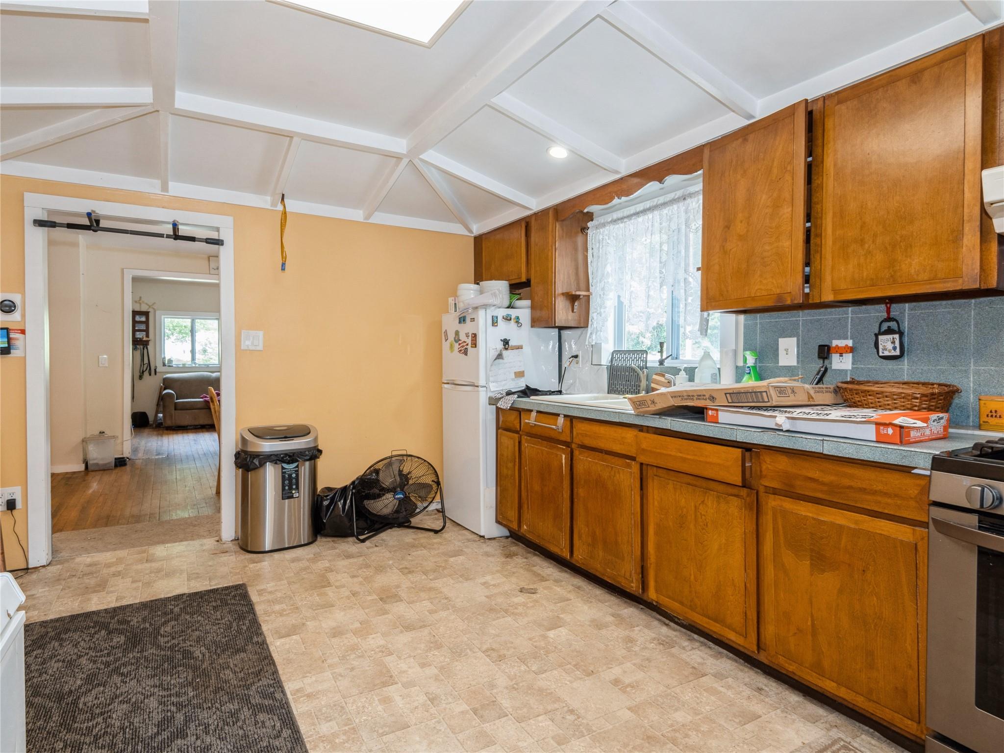 413 Vassar Road Poughkeepsie, NY 12603 - Photo 22 of 38 a kitchen with a sink cabinets and appliances