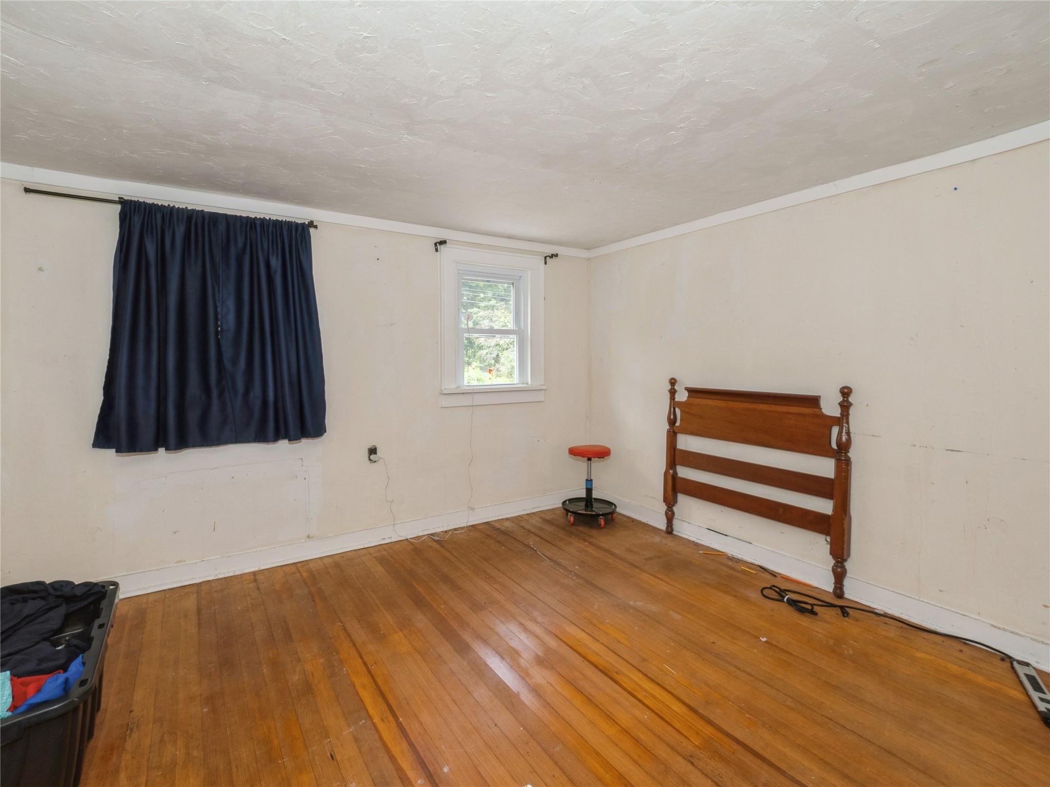 413 Vassar Road Poughkeepsie, NY 12603 - Photo 24 of 38 a room with a bed and a window