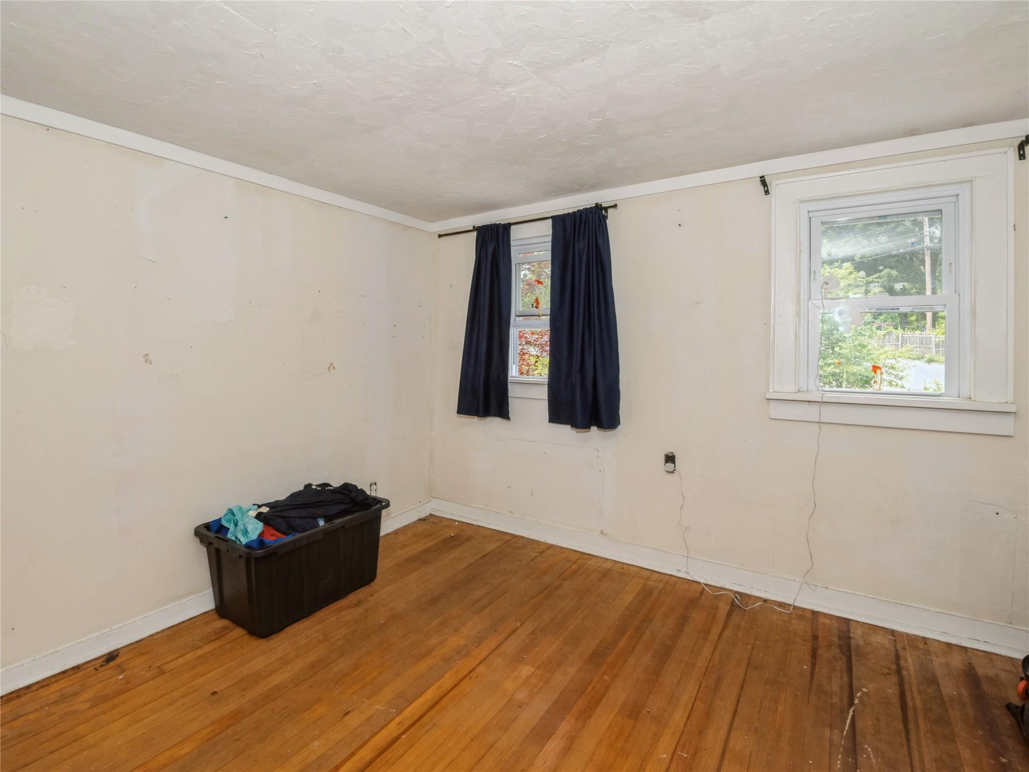 413 Vassar Road Poughkeepsie, NY 12603 - Photo 25 of 38 a room with window and a wooden floor
