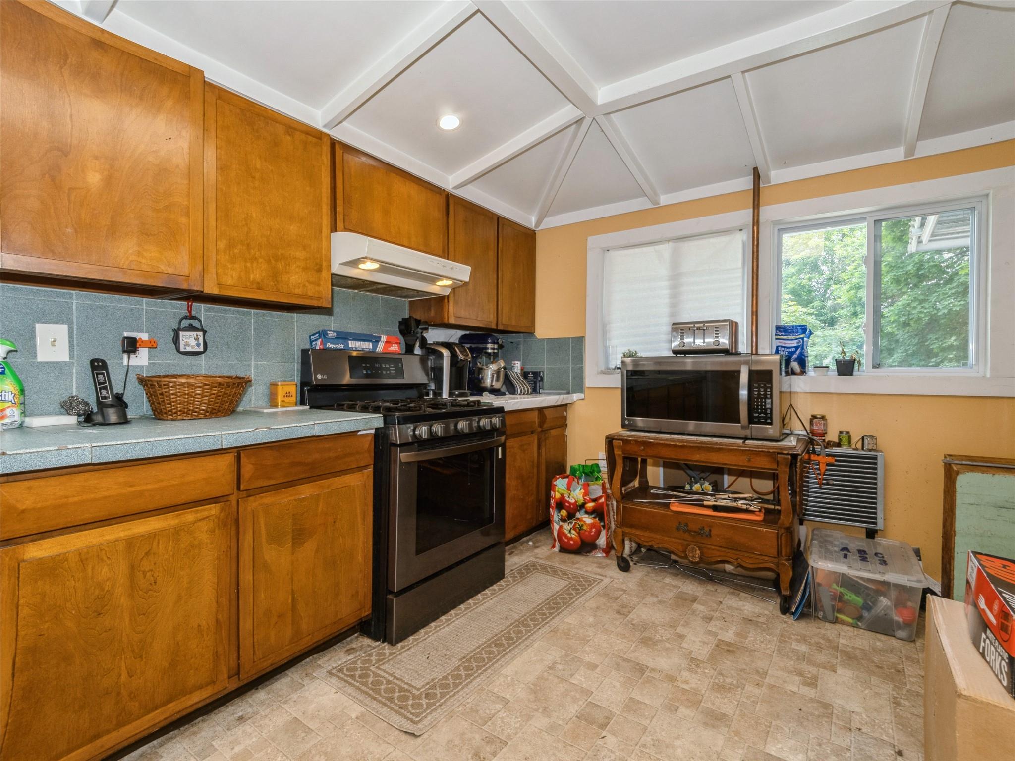 413 Vassar Road Poughkeepsie, NY 12603 - Photo 29 of 38 a kitchen with a sink appliances and cabinets