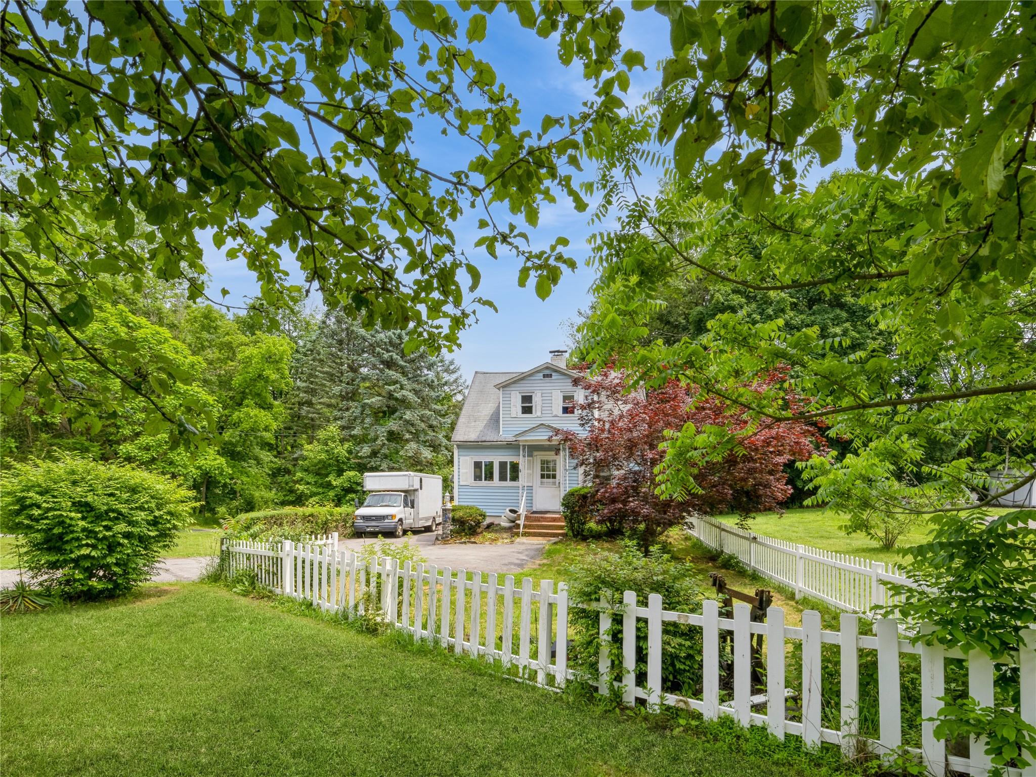 413 Vassar Road Poughkeepsie, NY 12603 - Photo 3 of 38 a view of house with a big yard and large trees