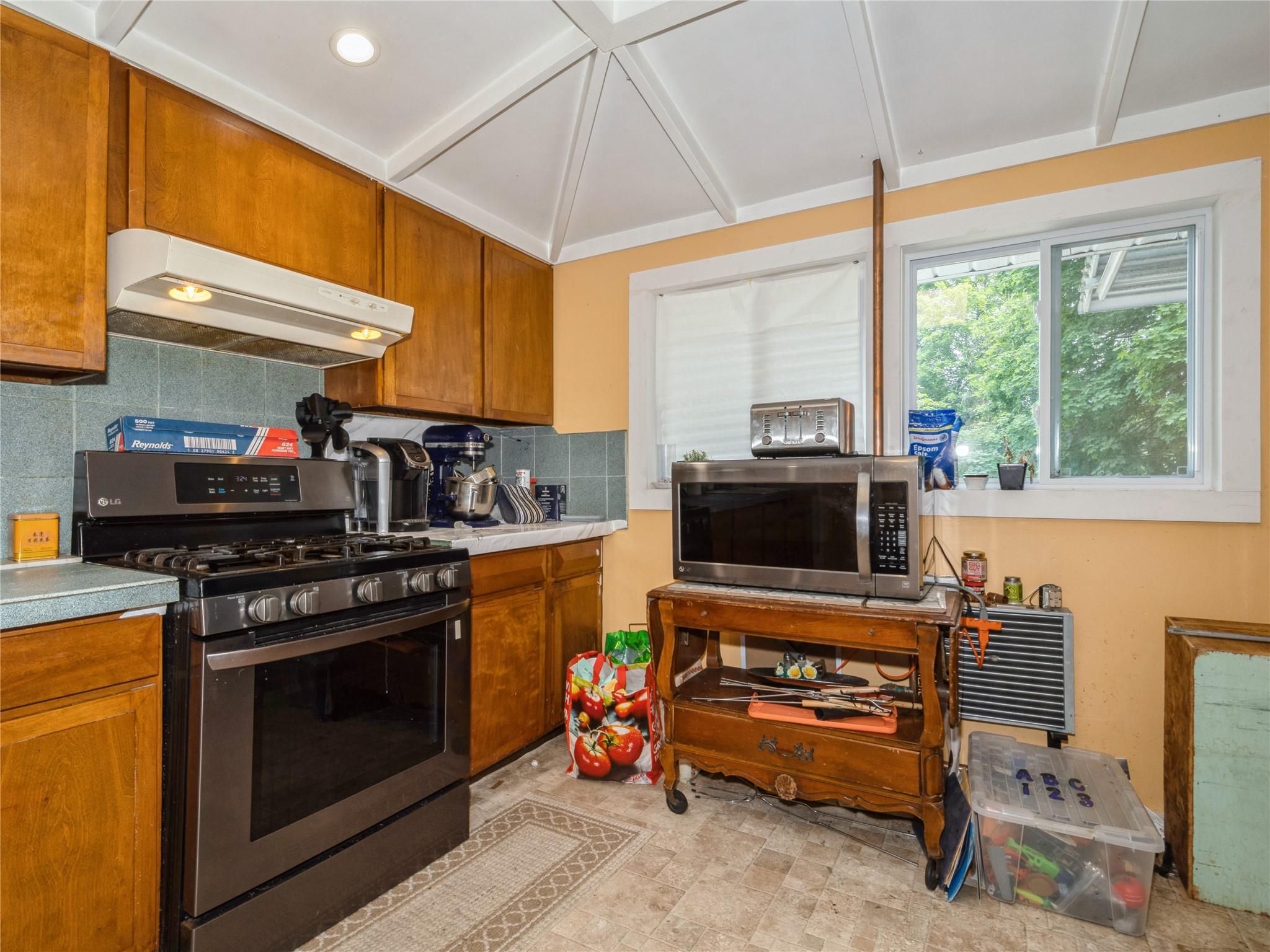 413 Vassar Road Poughkeepsie, NY 12603 - Photo 31 of 38 a kitchen with stainless steel appliances a stove a sink and a microwave