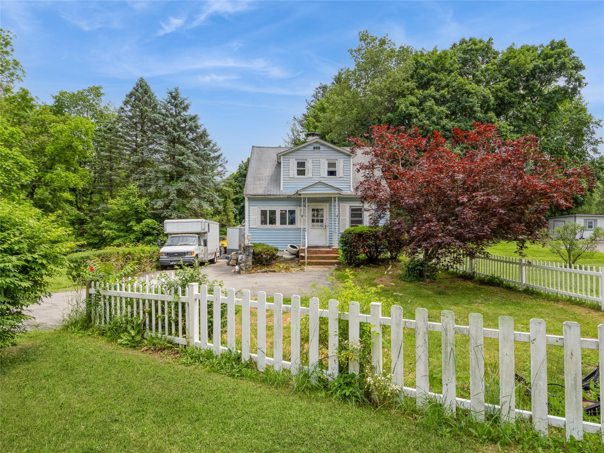 413 Vassar Road Poughkeepsie, NY 12603 - Photo 4 of 38 a view of a house with a yard and plants