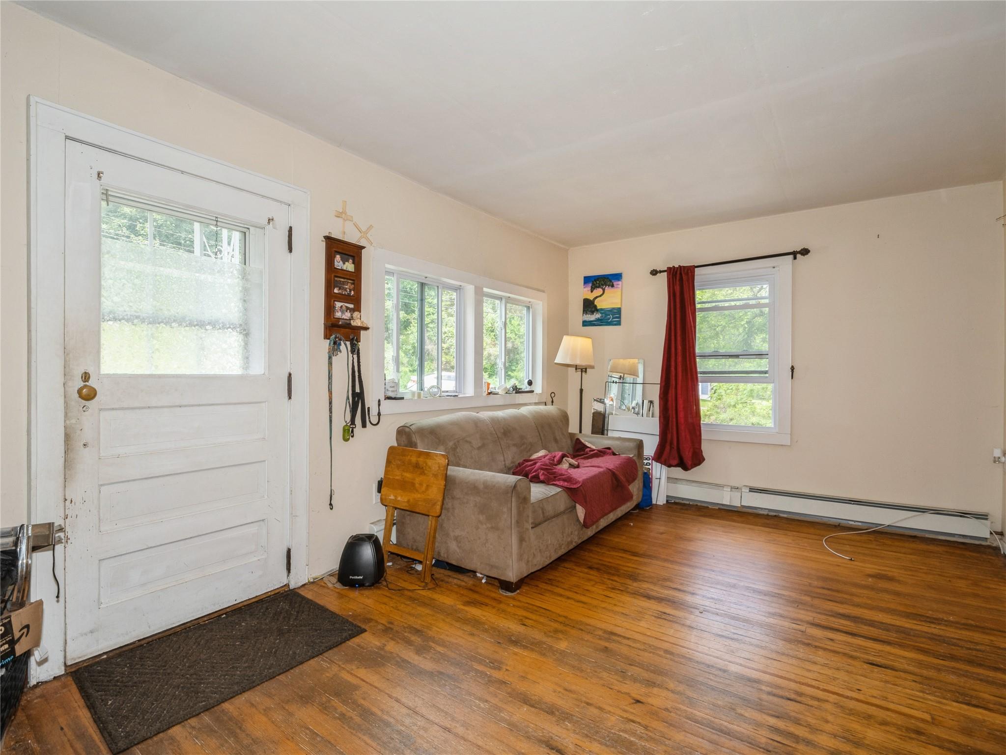 413 Vassar Road Poughkeepsie, NY 12603 - Photo 6 of 38 a living room with furniture and a window