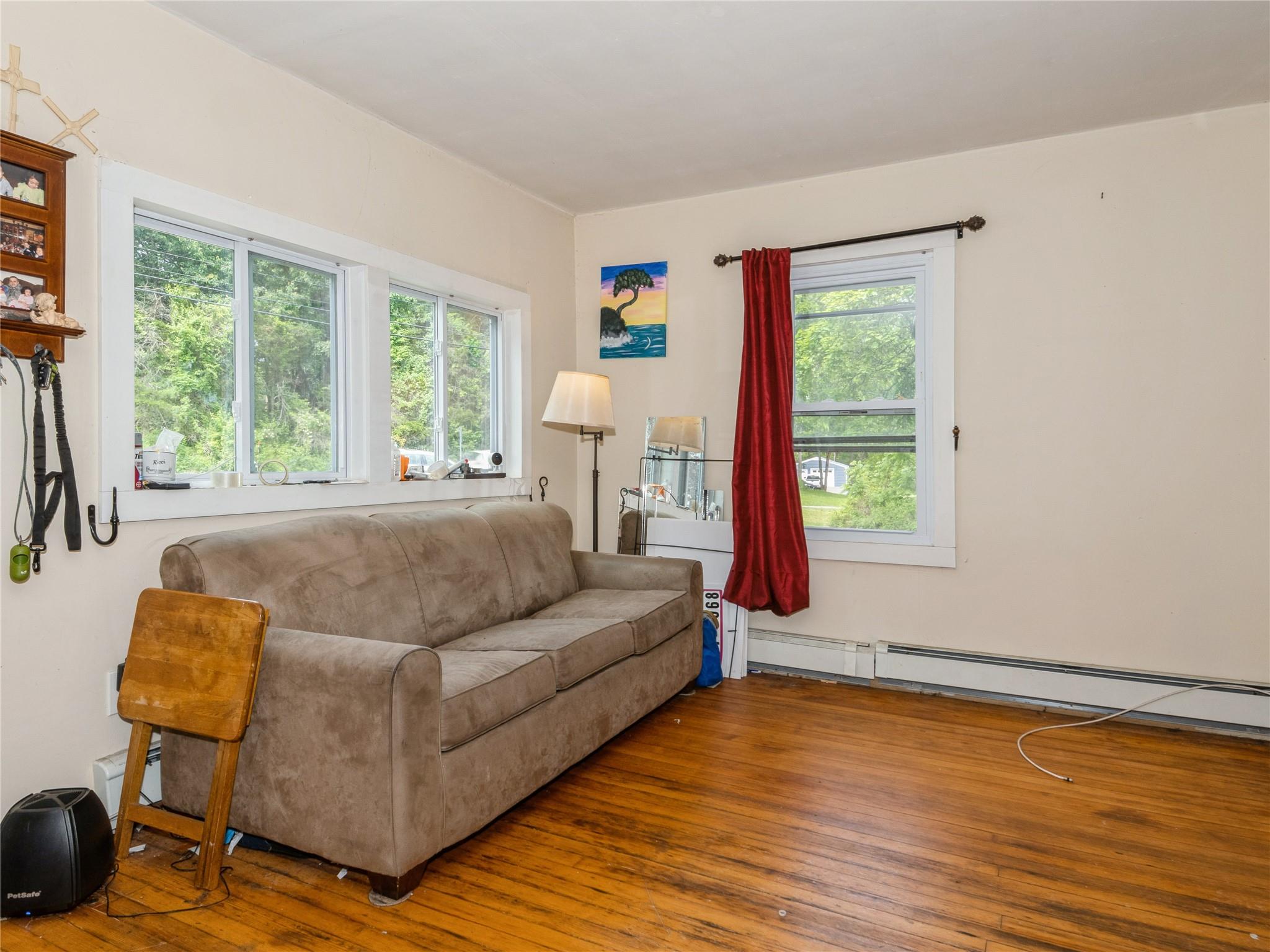 413 Vassar Road Poughkeepsie, NY 12603 - Photo 7 of 38 a living room with furniture and a window