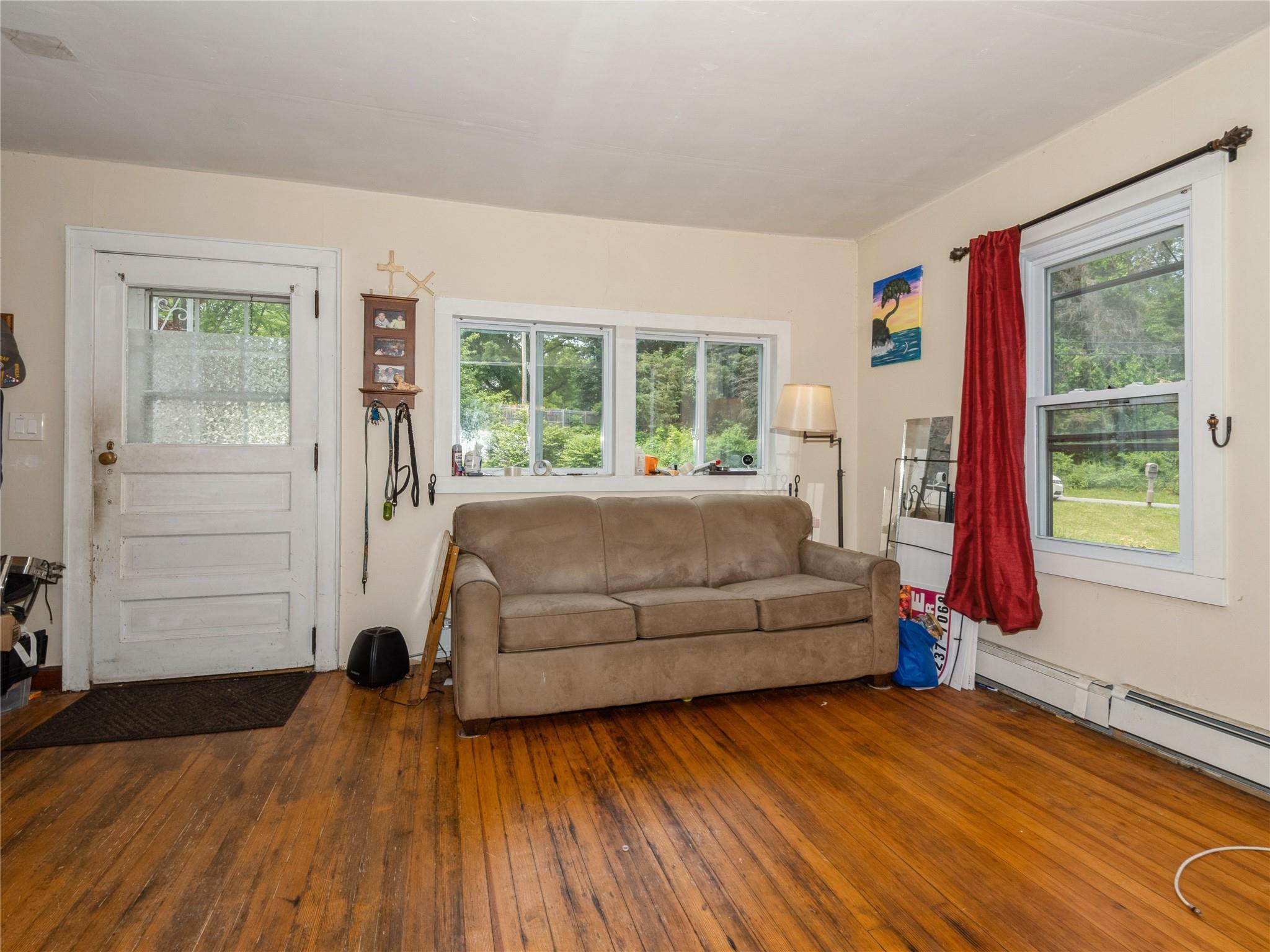 413 Vassar Road Poughkeepsie, NY 12603 - Photo 8 of 38 a living room with furniture and a large window