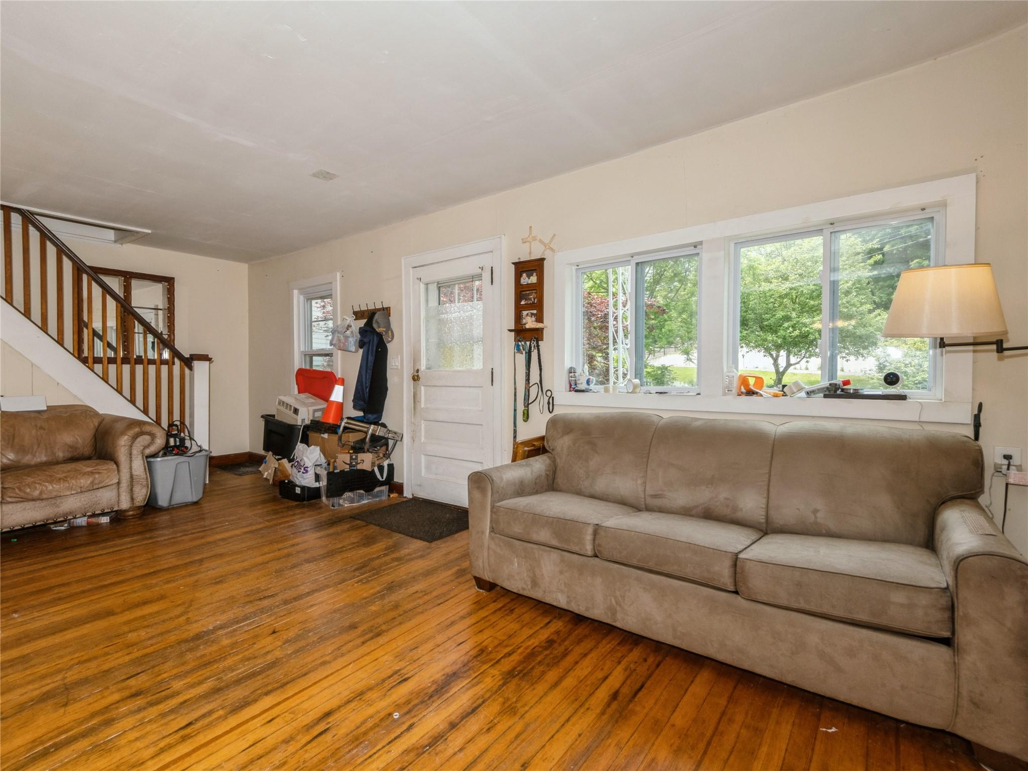 413 Vassar Road Poughkeepsie, NY 12603 - Photo 9 of 38 a living room with furniture and a large window