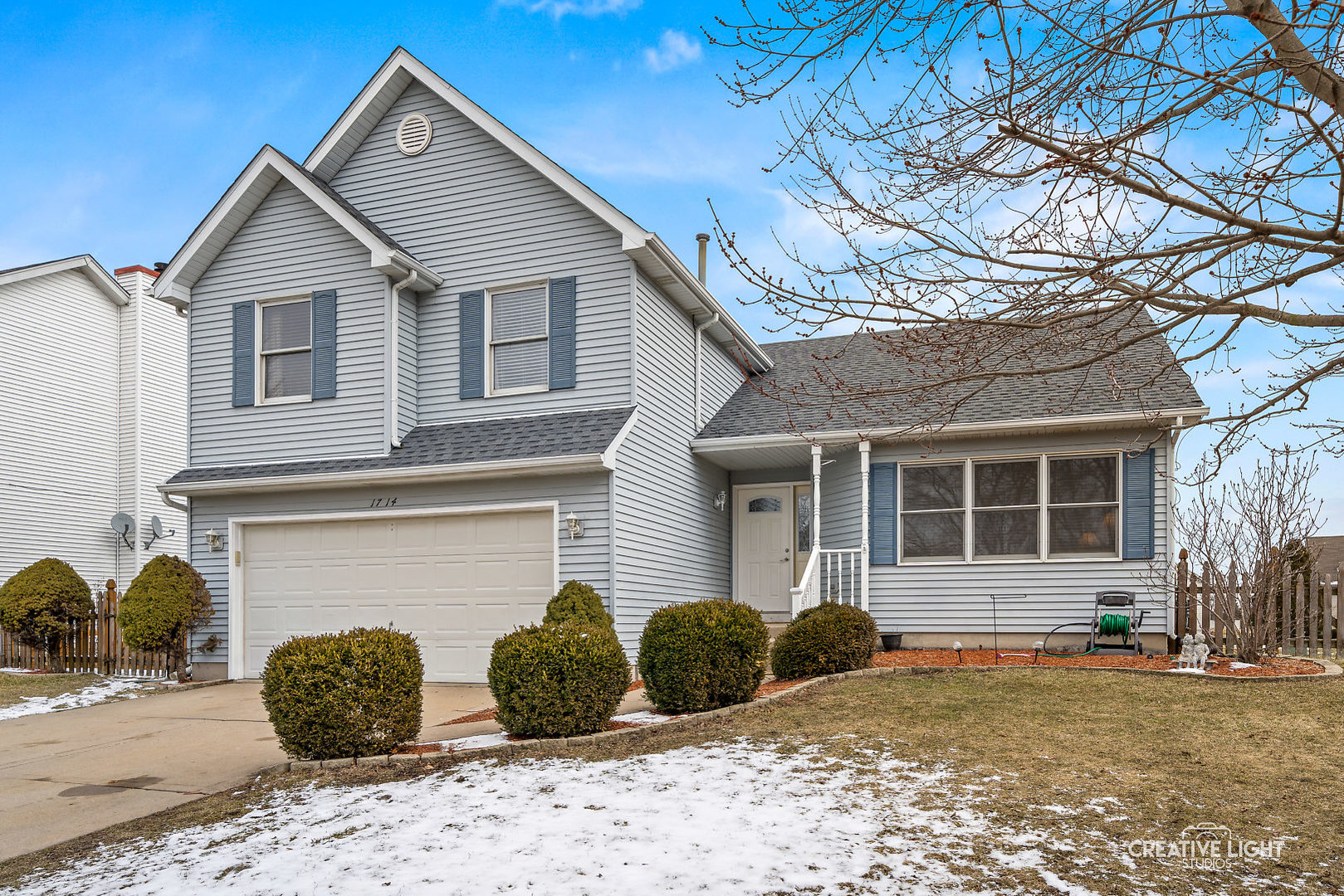 1714 Chestnut Hill Road Plainfield, IL 60586 - Photo 1 of 29 a front view of a house with a yard and garage