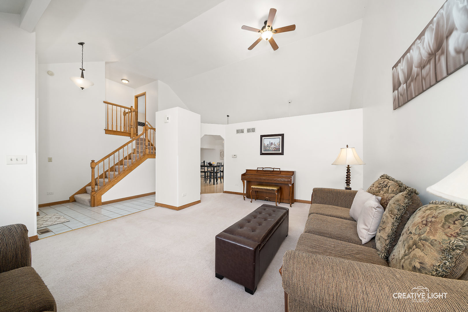 1714 Chestnut Hill Road Plainfield, IL 60586 - Photo 2 of 29 a living room with furniture and a ceiling fan