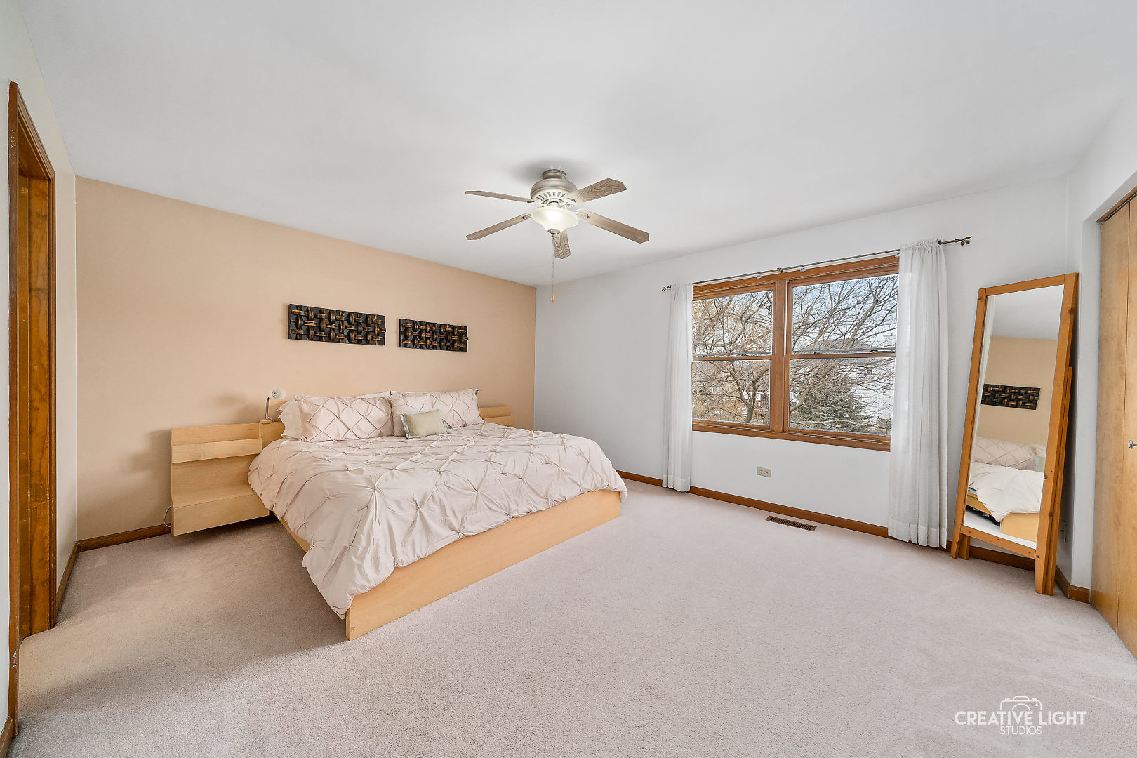 1714 Chestnut Hill Road Plainfield, IL 60586 - Photo 12 of 29 a spacious bedroom with a large bed and a chandelier