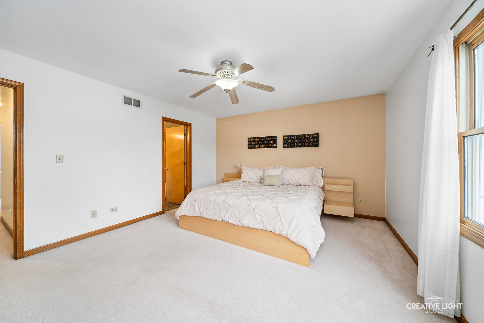 1714 Chestnut Hill Road Plainfield, IL 60586 - Photo 13 of 29 a bedroom with a large bed and a chandelier