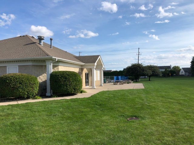 1714 Chestnut Hill Road Plainfield, IL 60586 - Photo 22 of 29 a view of a house with backyard porch and garden