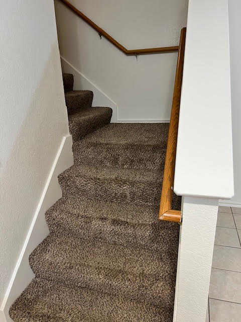 1012 Christopher Avenue, Unit B Round Rock, TX 78681 - Photo 19 of 34 Stairway with carpet floors and tile patterned flooring