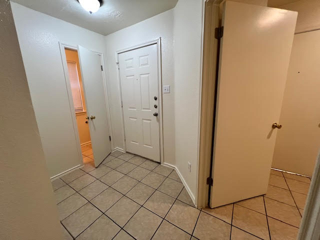 1012 Christopher Avenue, Unit B Round Rock, TX 78681 - Photo 3 of 34 Foyer entrance featuring light tile patterned floors