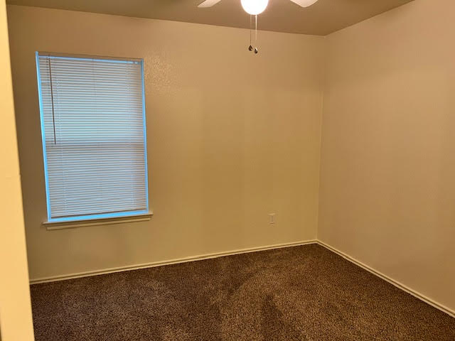 1012 Christopher Avenue, Unit B Round Rock, TX 78681 - Photo 31 of 34 Spare room featuring carpet flooring and ceiling fan