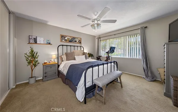 a bed room with a bed and a chandelier