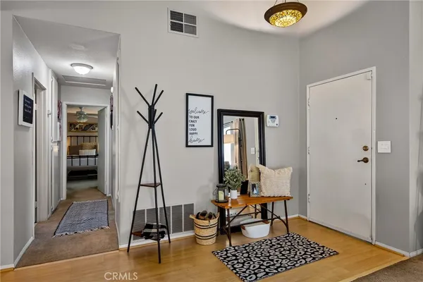 a view of dining room with wooden floor and a table