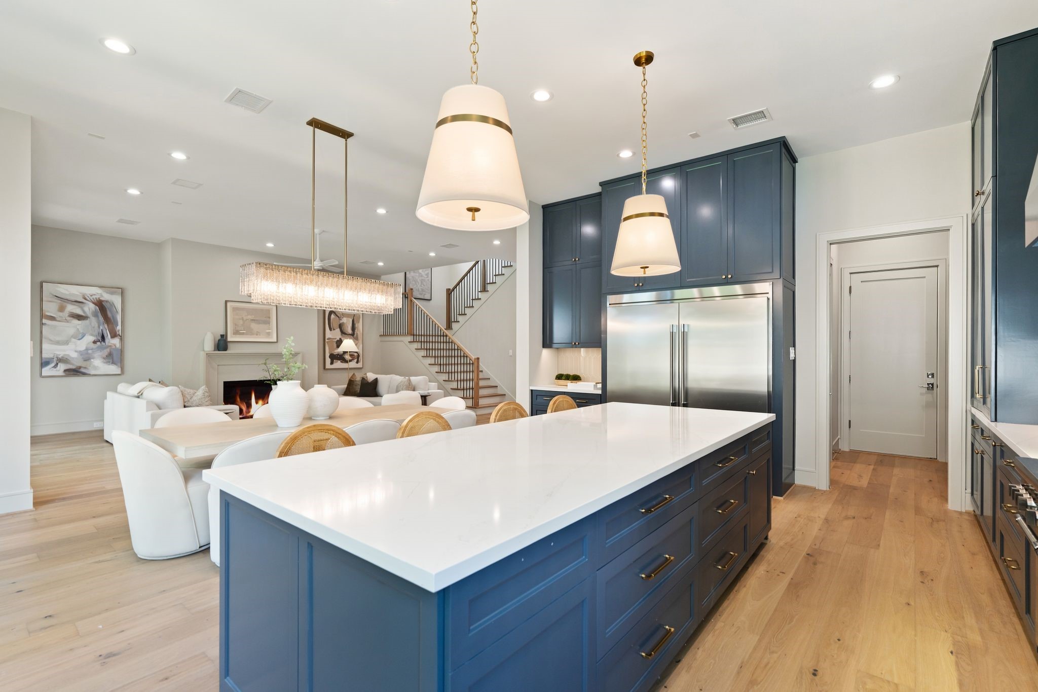 711 East 12th Street Houston, TX 77008 - Photo 22 of 47 Close view of the substantial kitchen island, showcasing polished quartz, elegant cabinetry and a sophisticated material palette.