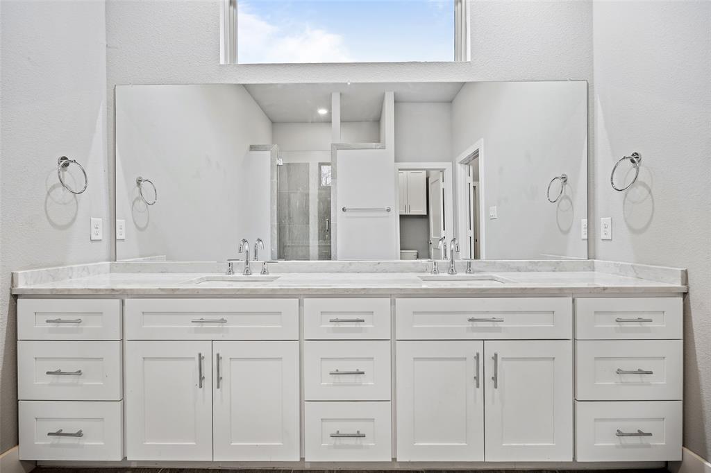 4226 Roseland Avenue, Unit 201 Dallas, TX 75204 - Photo 15 of 24 a bathroom with white cabinets and a sink