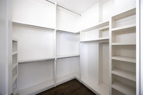 a view of an empty walk in closet