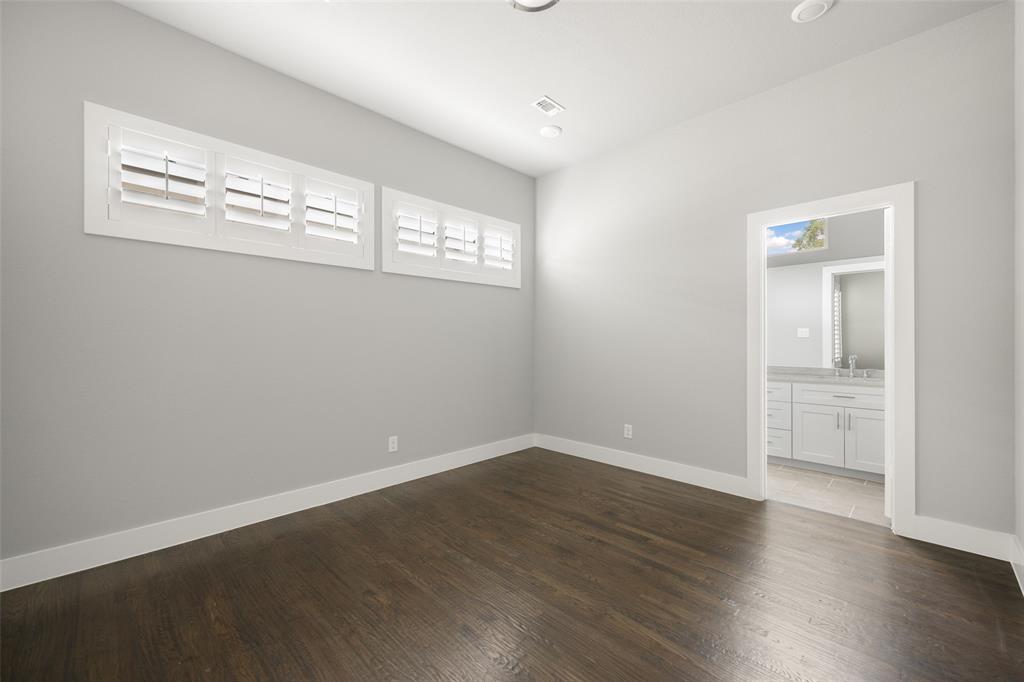 4226 Roseland Avenue, Unit 201 Dallas, TX 75204 - Photo 18 of 24 a view of empty room with wooden floor and fan