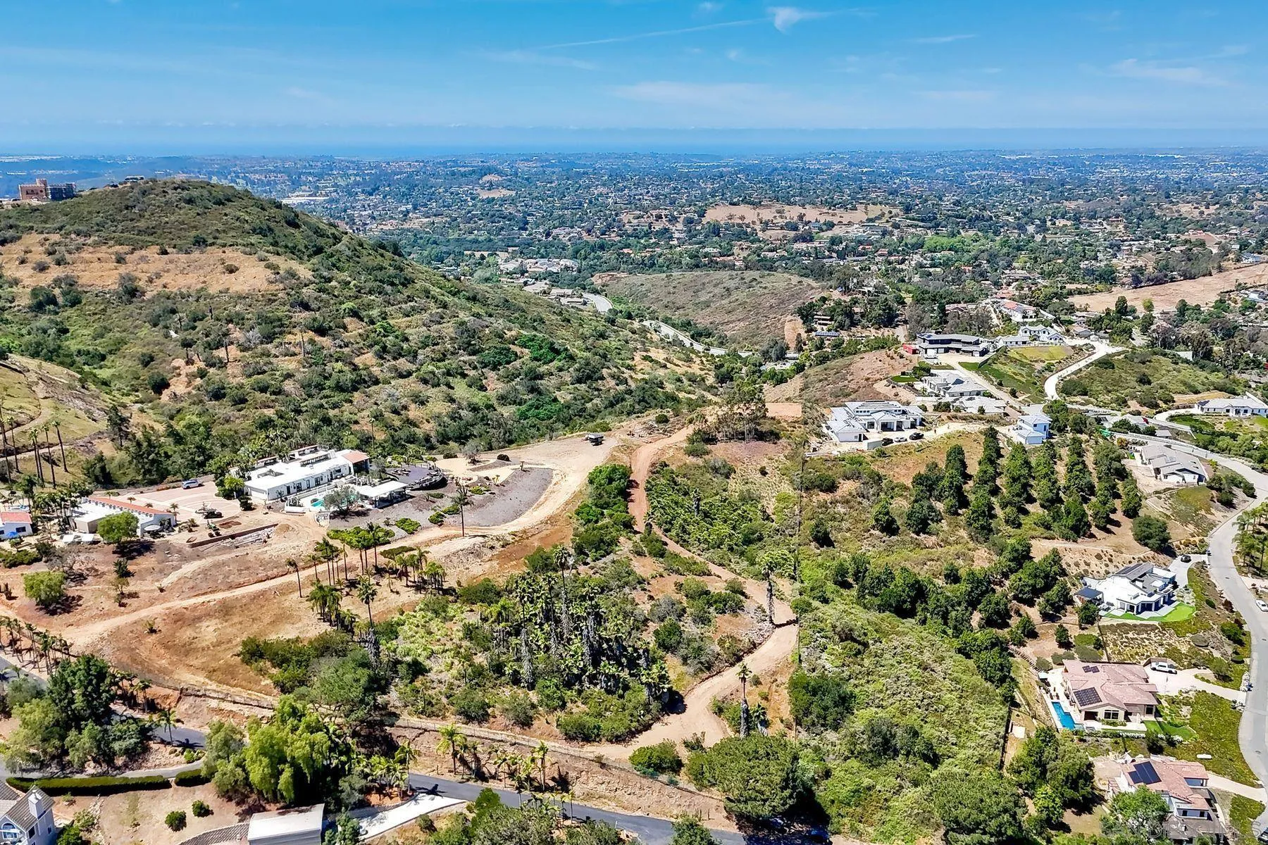 0 Buena Creek Road, Unit 39 Vista, CA 92084 - Photo 1 of 18 an aerial view of a houses with a yard
