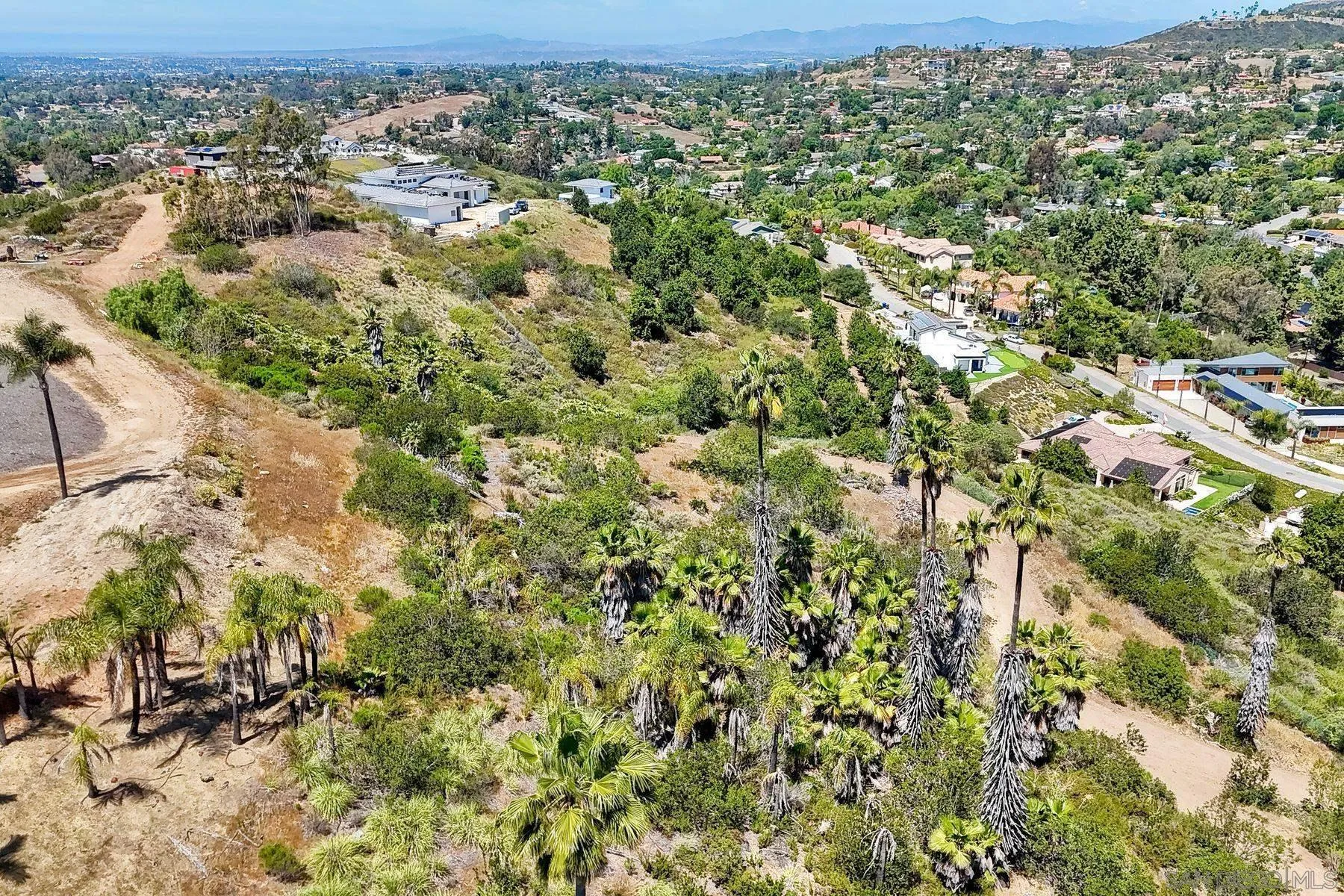 0 Buena Creek Road, Unit 39 Vista, CA 92084 - Photo 9 of 18 an aerial view of residential houses with outdoor space