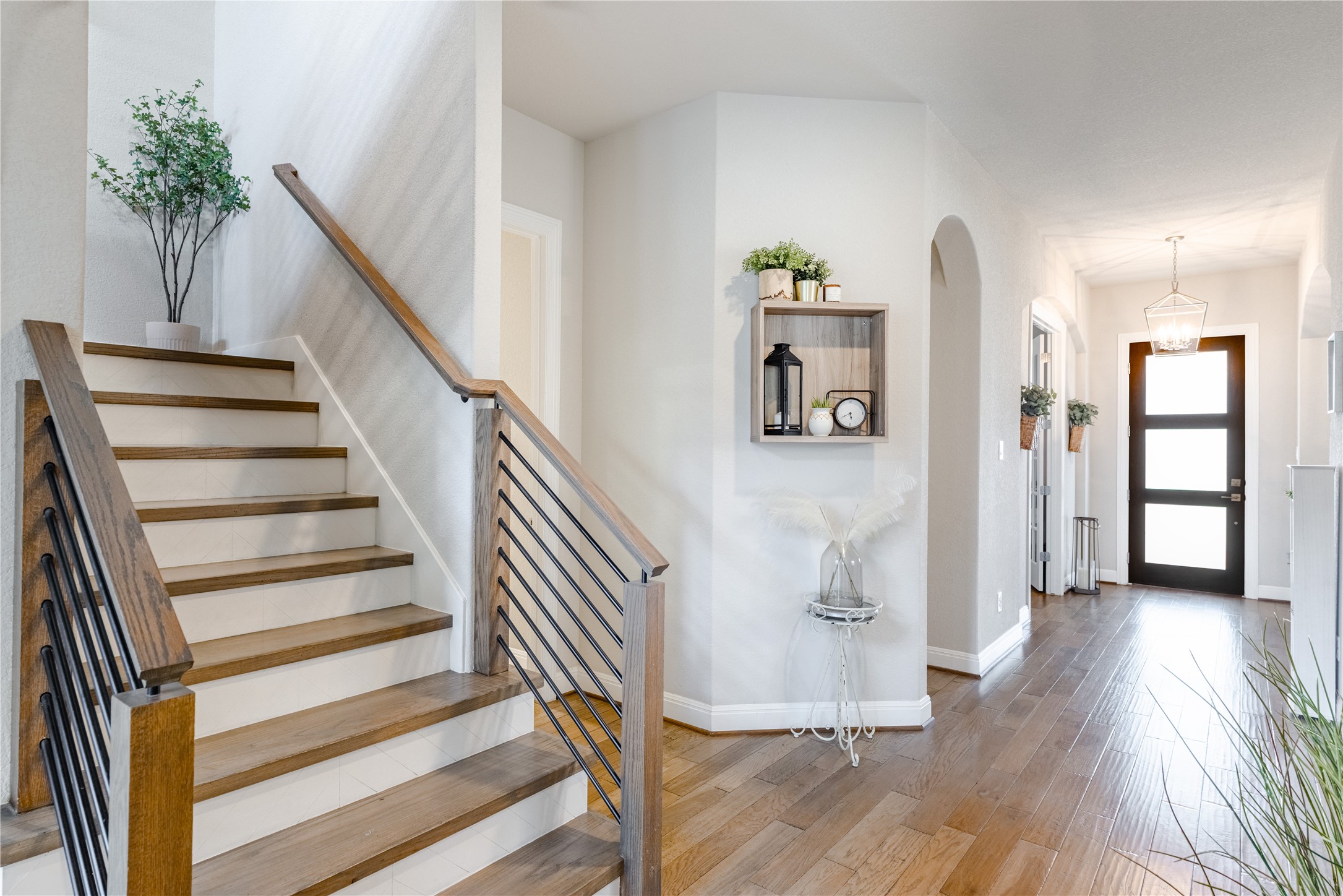 20524 Fairleaf Street Pflugerville, TX 78660 - Photo 16 of 35 Foyer with light wood-style floors and arched walkways