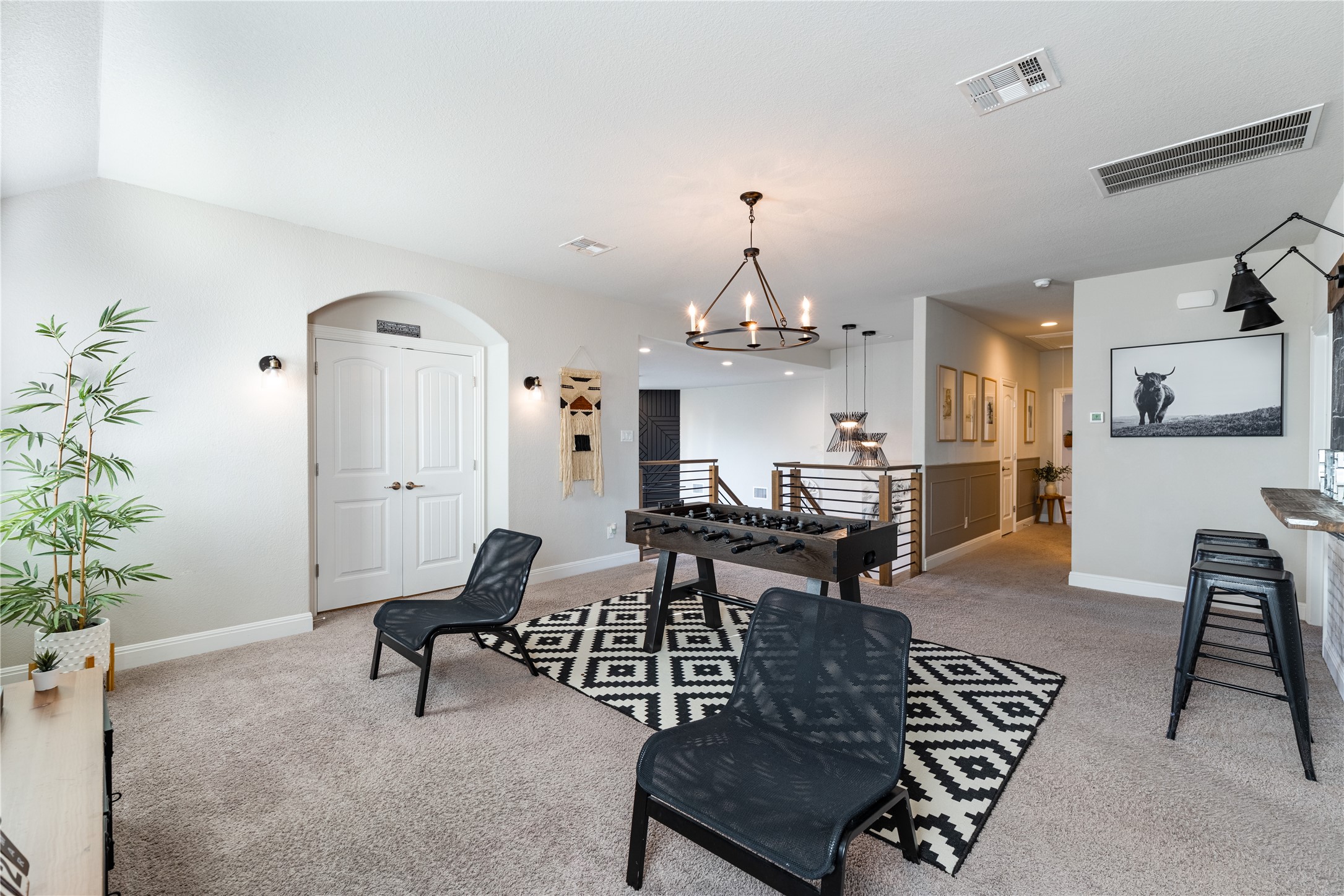 20524 Fairleaf Street Pflugerville, TX 78660 - Photo 19 of 35 Playroom with light carpet and a chandelier