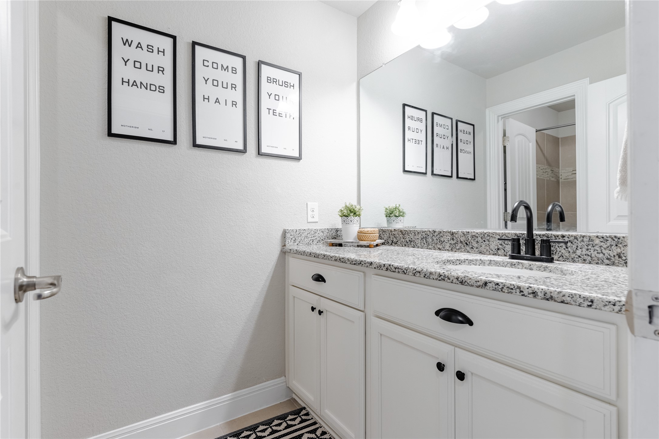 20524 Fairleaf Street Pflugerville, TX 78660 - Photo 26 of 35 Bathroom featuring vanity and a textured wall